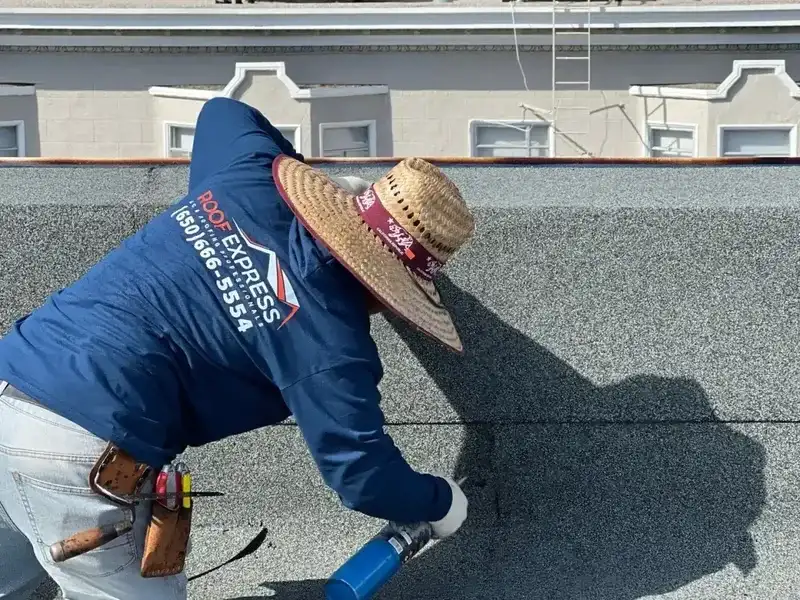 ROOF EXPRESS roofer sealing a roof repair